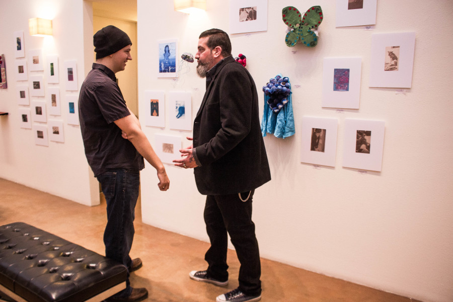 Michael Webb talks with SFUAD photo student Forrest Sopor at the Monte del Sol Exhibition held at The Marion Center every year.