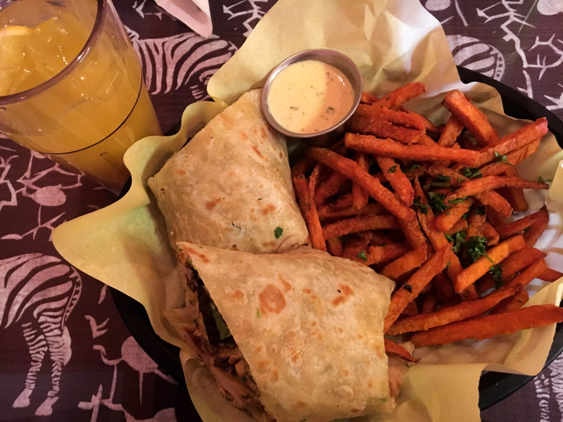 Eating at Jambo, I enjoyed the mango ginger lemonade with the curried chicken salad wrap and a side of sweet potato fries. Photo by Whitney Wernick