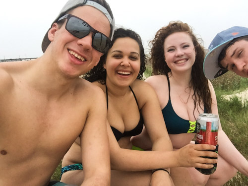 Jason Stilgebouer, Stefanee Chevailer, Alyssa Vogel, and Shae Brewer enjoying their spring break on the beach in Surfside Beach, TX. Photo by Jason Stilgebouer.