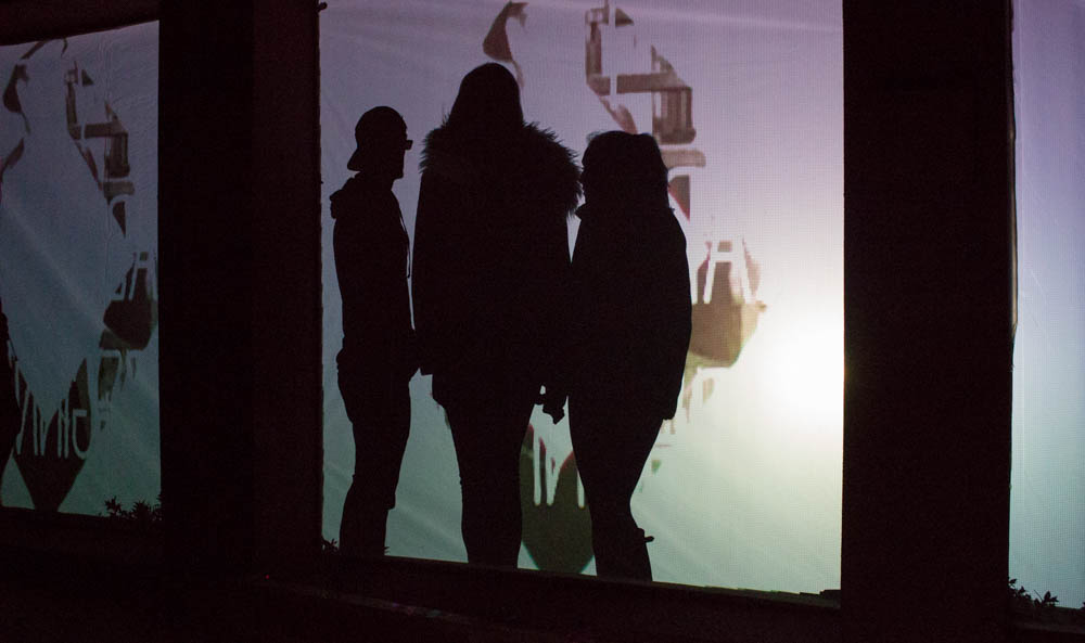 A group of students plays around with one of the many interactive light shows at OVF. Photo by Kyleigh Carter.