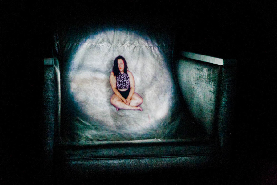 Small figure projected onto a chair with audio at OVF 2016. Photo by Whitney Wernick.