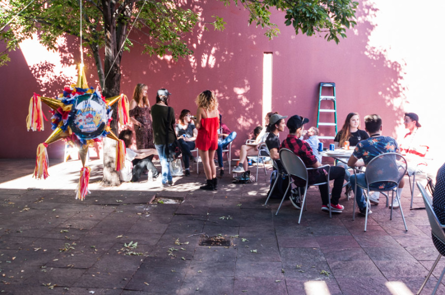 Photography students gathering in the Marion Center courtyard for the department barbecue. Photo by Sasha Hill