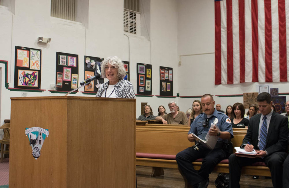 Linda Kastner, one of 500 citizens who signed the Chain Free petition, addresses the Santa Fe County Commissioners on Sept.13. Photo by Chris Dorantes