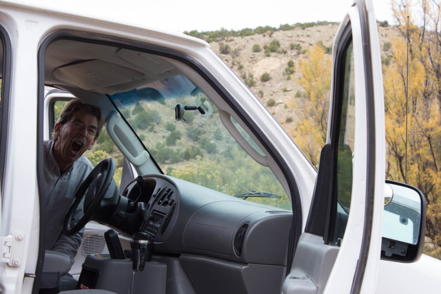 Tony O’Brien, head of the Department of the Photographic Arts, making a silly face from inside SFUAD’s white van along the Chama River. Photo by Cris Galvez.