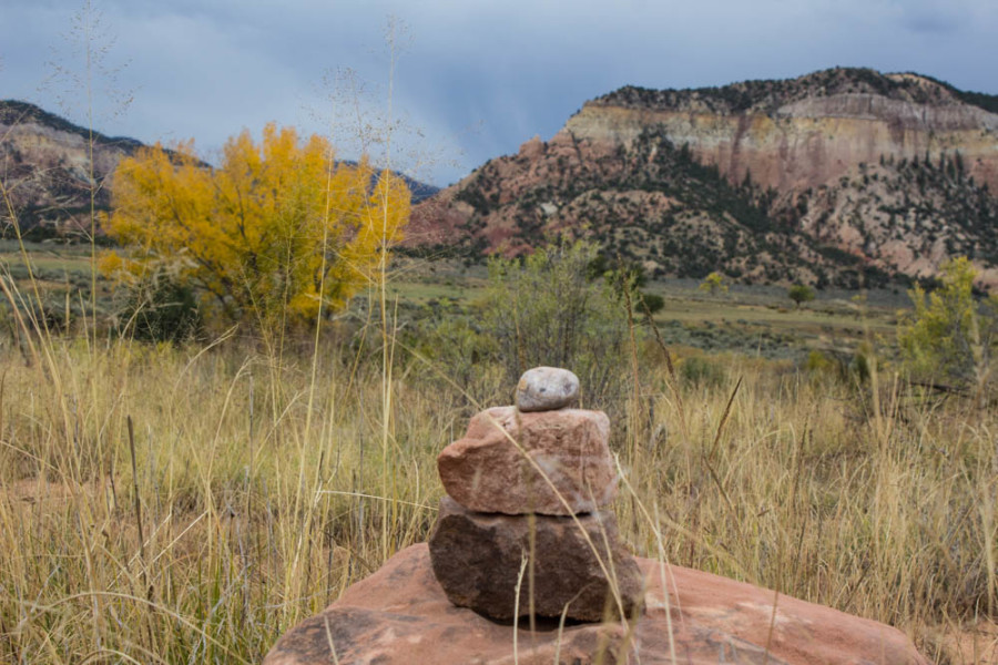 A small stack of rocks with the fall colors in the background near the Chama River Canyon. Photo by Cris Galvez.