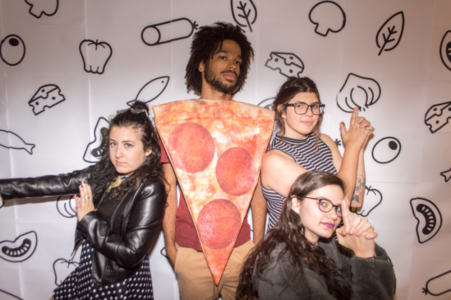 (From left to right) Graphic Design Seniors Callan Ramirez, Julian Williams, Mariah Romero, and Syndey Rayne pose for the “Another Show about Pizza” photobooth. Photo by Jennifer Rapinchuk