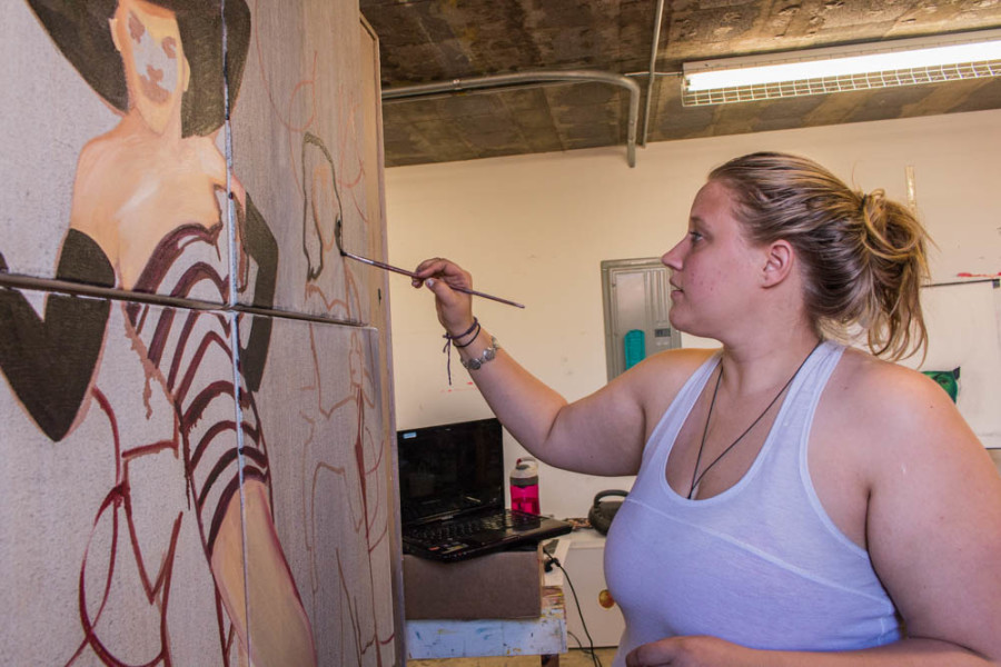 Sophomore Studio Arts major Shasta Scott painting on a canvas for her advanced painting class. Photo by Yoana Medrano.