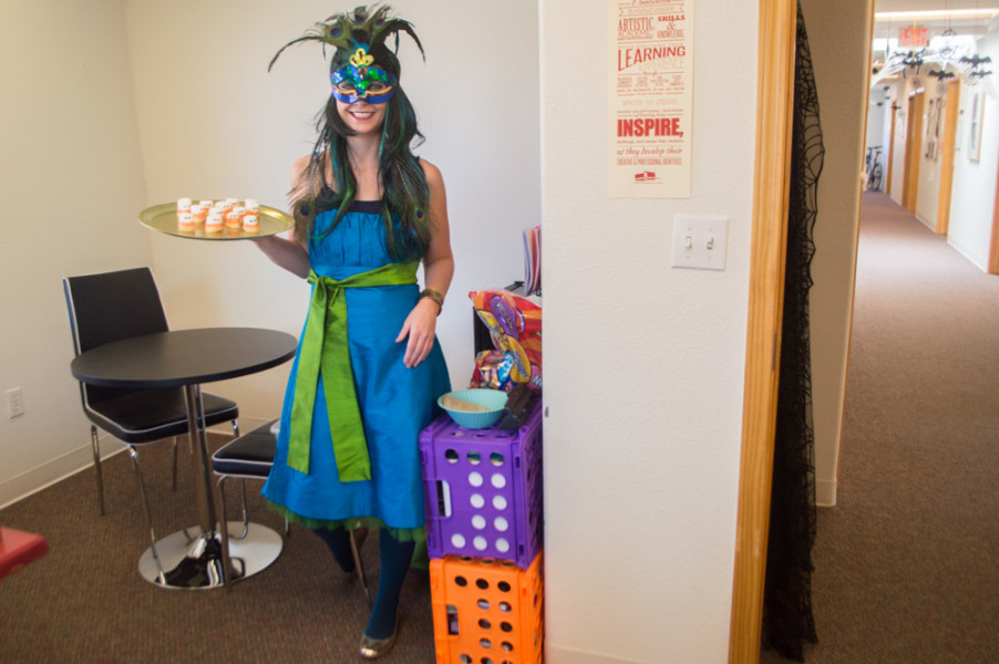 Career Counselor Deanne Brown welcomes students into her office as a peacock this Halloween, offering students tasty marshmallow treats. Photo by Jennifer Rapinchuk