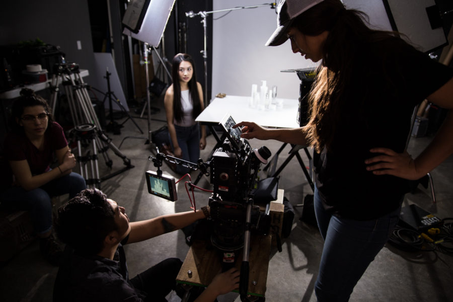 Director of photography Phillip Hoang and assistant camera Alejandra Castro line up the next shot for the products. Photo by Jason Stilgebouer.