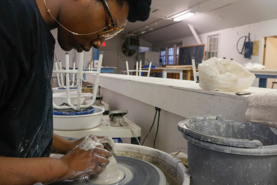 Sophomore Studio Arts major Elisis Miller shapes another bowl for class. Photo by Jesus Trujillo.