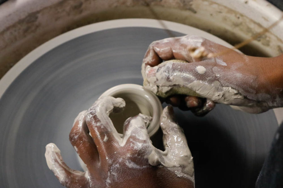Studio Arts sophomore Elisis Miller shapies a clay bowl. Photo by Jesus Trujillo.