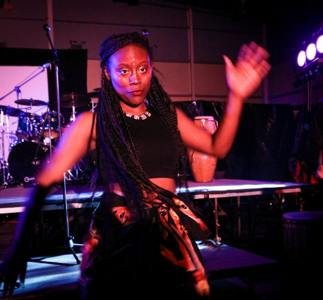 Cabria Scott dances to the rhythm of african beat in Black history month celebration. Photo by: Hawie Veniegas