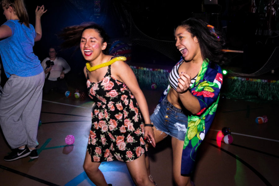 Laura Leal and Analyss Robles laughs and dances to the rhythm of the music. Photo by Hawie Reyne Veniegas. 