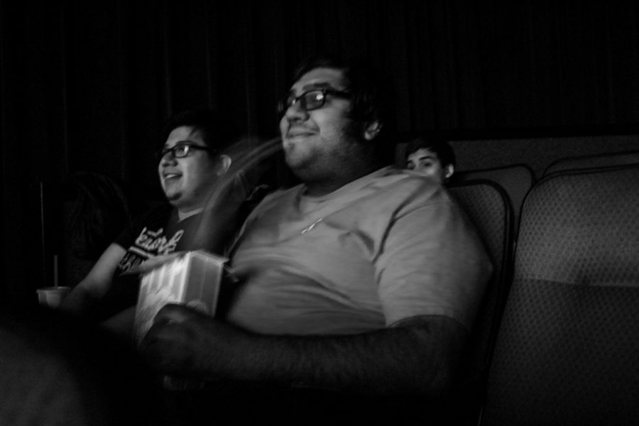 Warren Couvillion (right) and Omar Hilario founders of Club-Along joyfully watches “The Lion King” with the rest of the students. Photo by: Hawie Reyne Veniegas