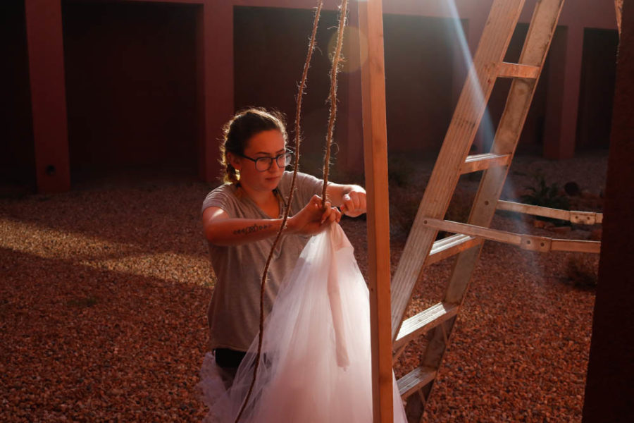 Leah Naxon, sets up her piece for Outdoor Vision Fest to try and make any final adjustments. Photo by Jesus Trujillo.