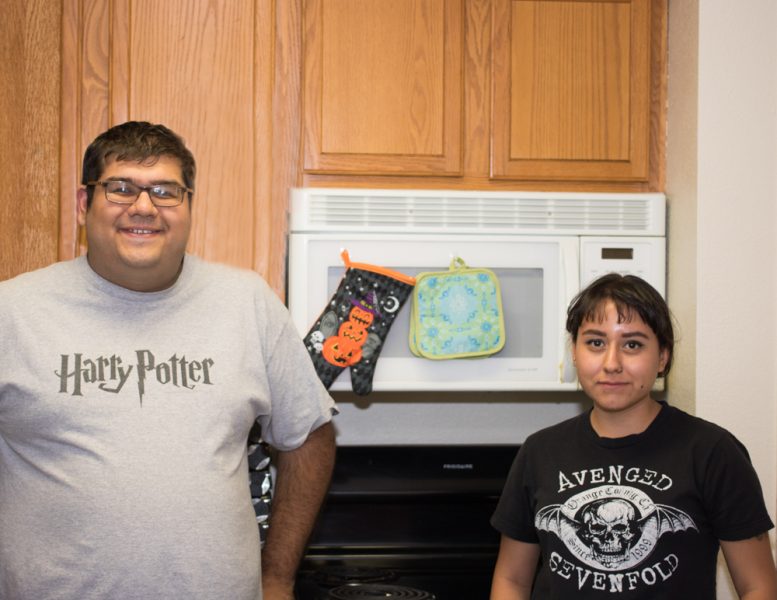 Warren Couvillion (left) and Garrett Johnston love being able to cook meals in their apartment kitchen. Photo by Chris Dorantes