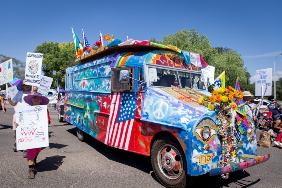 The Veterans for Peace retro bus as it moves down Guadalupe Street during the  Historical Hysterical Parade during Fiestas on Sept. 10. Photo by Jason Stilgebouer