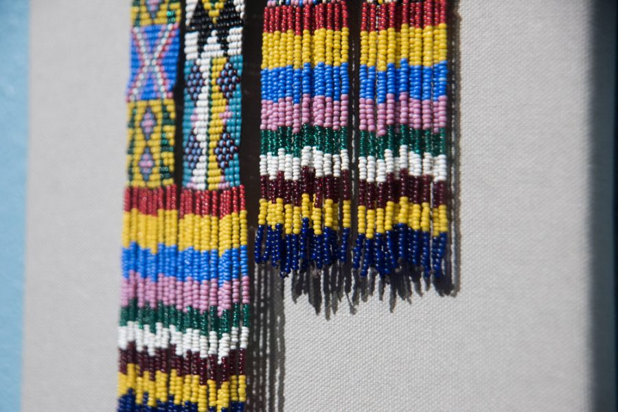 Minute details of a hand beaded North American Native Indian scarf. Photo by Sasha Hill