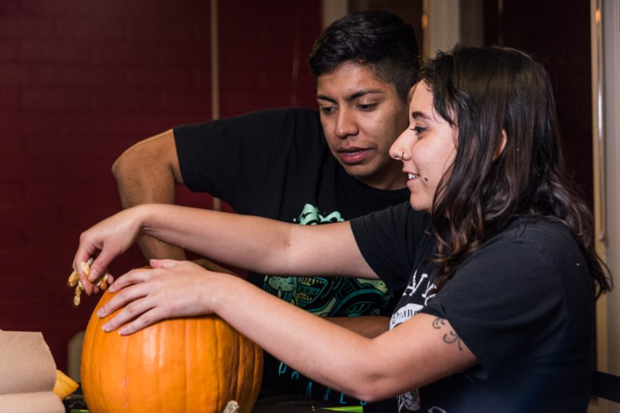 cleaning out their pumpkins. Photo by Sasha Hill