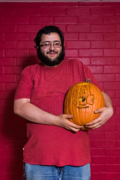 poses with his pumpkin. Photo by Sasha Hill