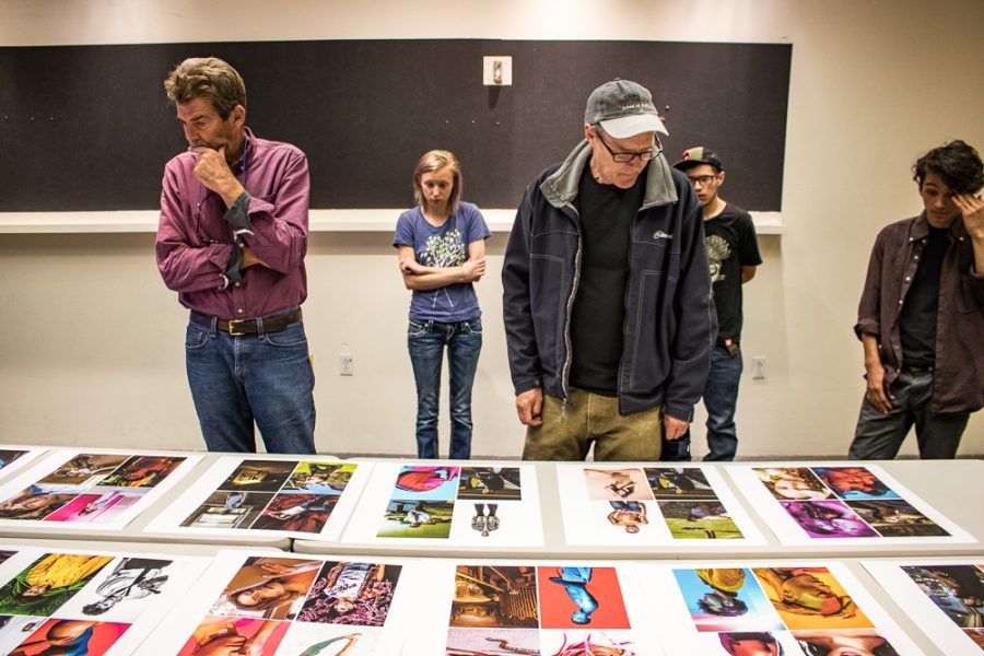 Photography Department Lead Faculty Tony O’Brien and Portrait and Fashion Instructor Eric Swanson analyze Marco Rivera’s photographs. Photo by Chris Dorantes